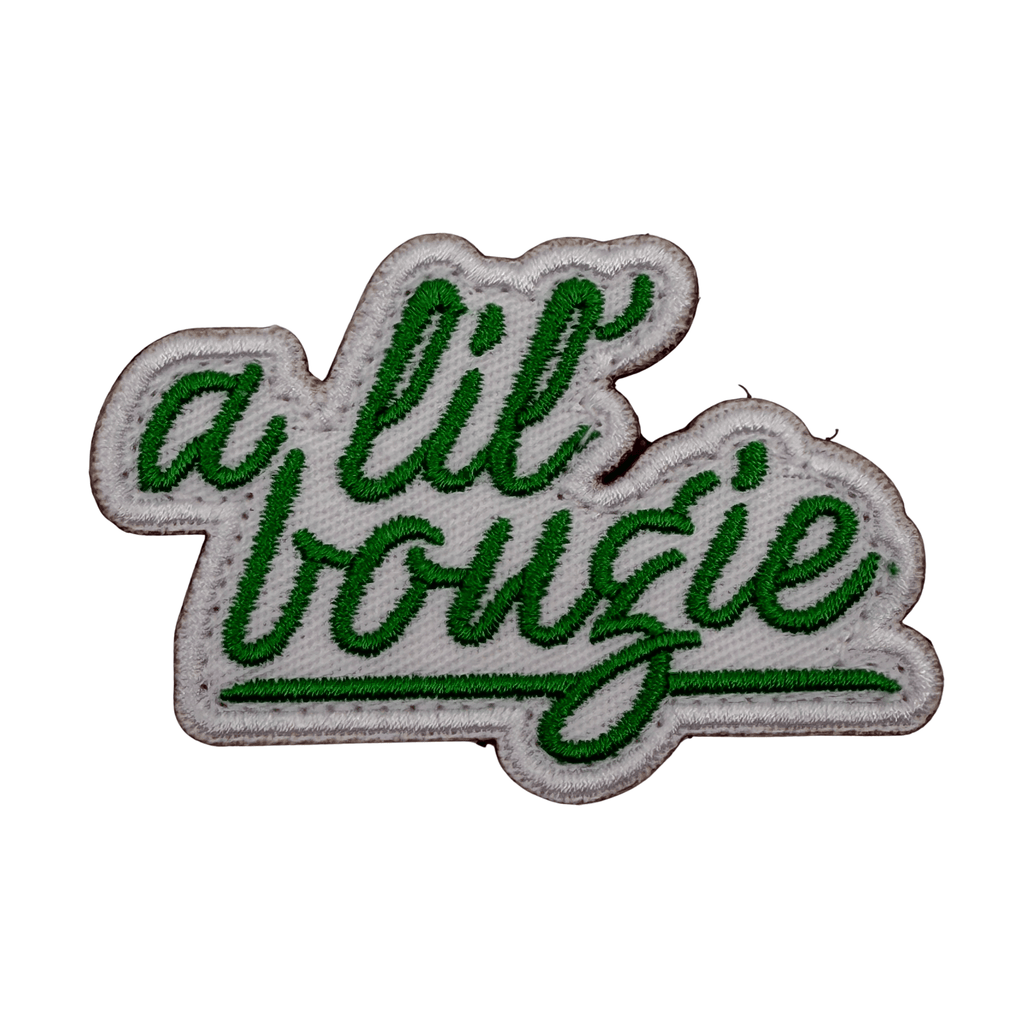 Die Cut Embroidered patch with 'a lil bougie' text in green on a white background