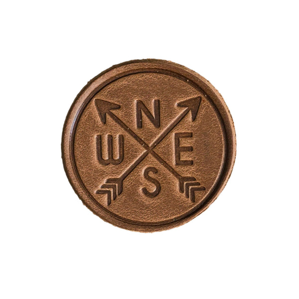  Compass Patch - Cafe Leather, Handmade with High-Quality Full-Grain Leather with Velcro® brand backing, this leather Compass Rose Hiking Patch is 2.25" x 2.25" round looks great on our Notch tactical/ operator caps, backpacks and jackets and more. Made in the USA.