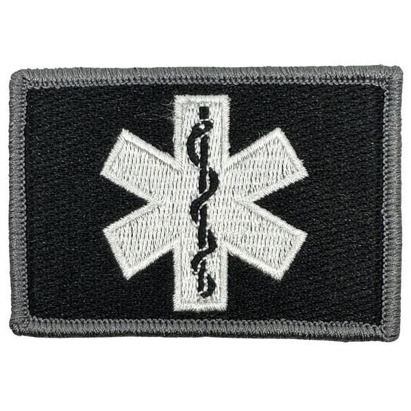 EMT Star of Life Patch - Black-White

The Star of Life is a blue, six-pointed star, outlined with a white border which features the rod of Asclepius in the center


Internationally, it represents emergency medical services (EMS) units and personnel

Highest stitch count embroidery

Embroidered patch

Velcro® brand backing

Made in the USA

2" x 3" sized for our tactical/operator caps