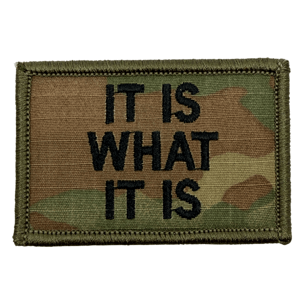 Multicam patch with 'IT IS WHAT IT IS' text in black on a multicam background.