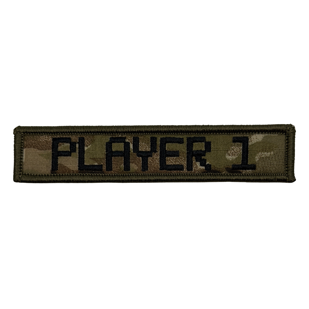 Camouflage Embroidered 1"x5" patch with 'PLAYER 1' text in black on a multicam background