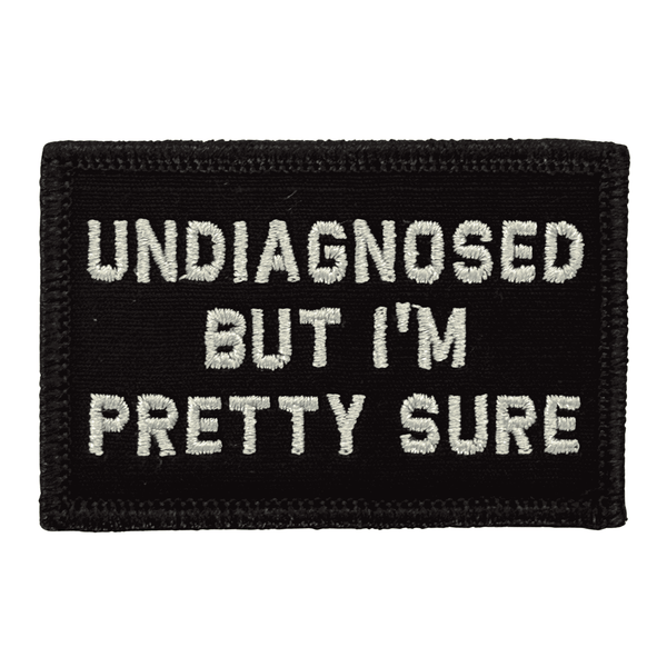 Black embroidered patch with "Undiagnosed But I'm Pretty Sure" in White text with hook backing