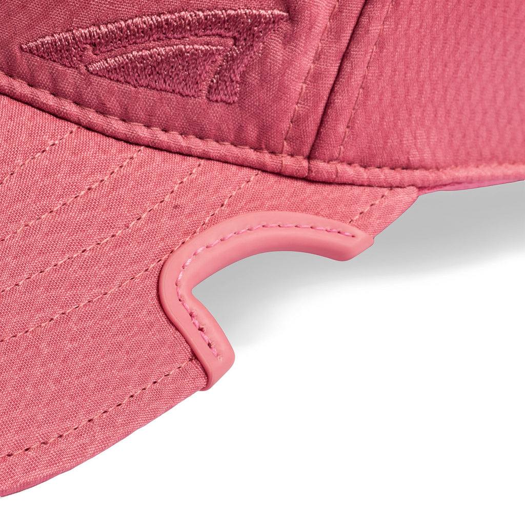 Close-up of patented Notch cut out to accommodate your eyewear and monochromatic pink embroidered Notch logo on Athlete Pink Ponytail cap