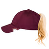 Notch Athlete burgundy cap side view showing blonde ponytail through back opening