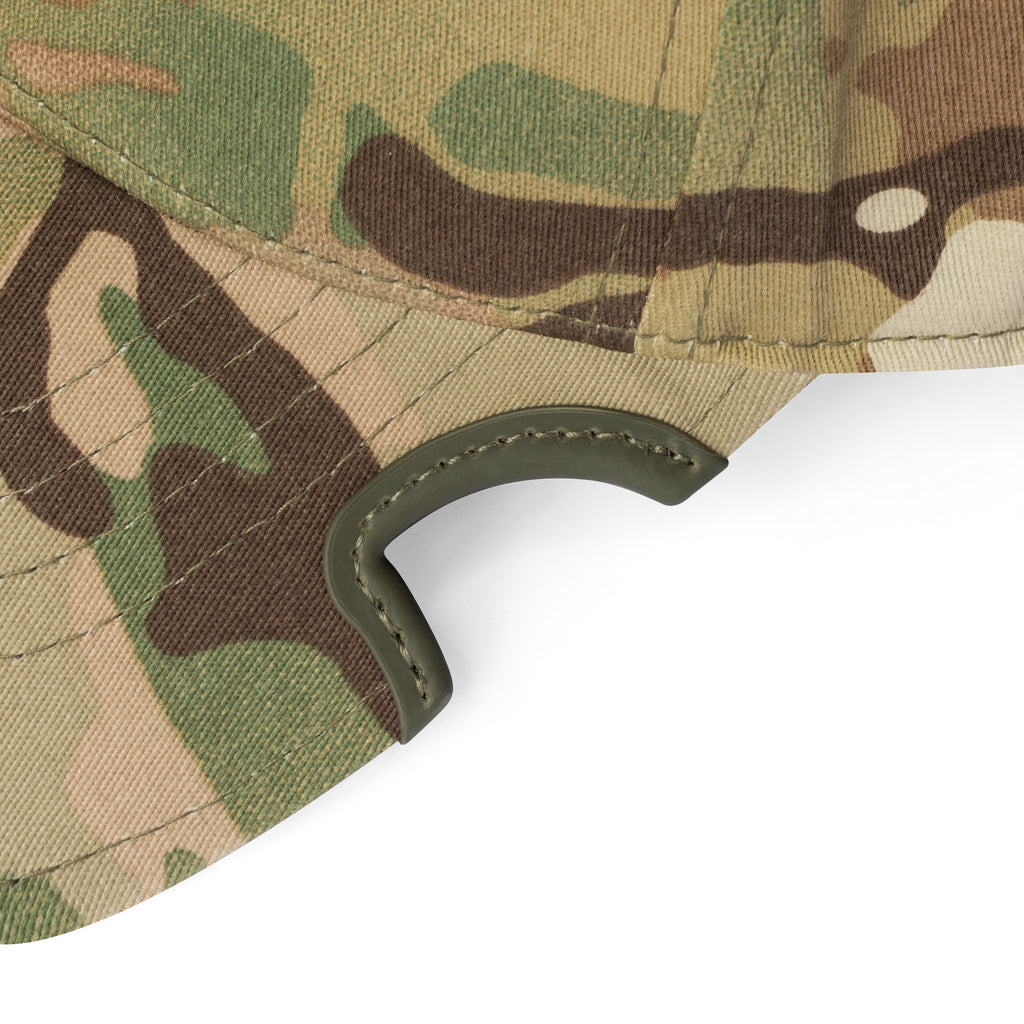 Close-up detail of patented notch on MultiCam Flexfit cap brim with camouflage pattern