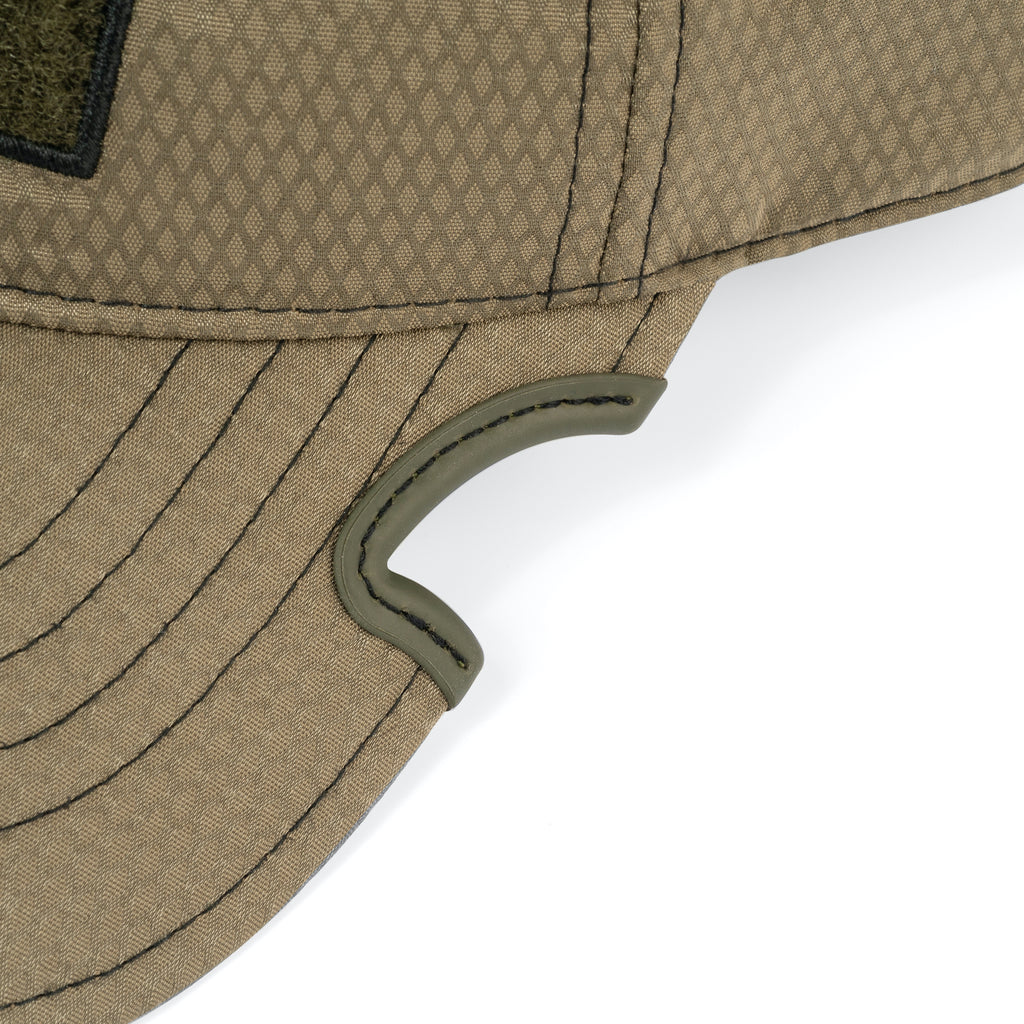 Side view of Notch Athlete Operator OD green cap showing patented notch and low profile fit